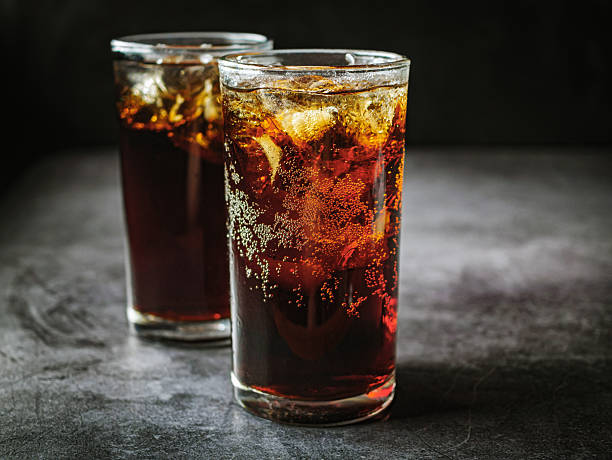 Two glasses of iced soda